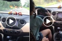 Bố cho con gái nhỏ lái ô tô, mẹ ngồi sau khen nức nở