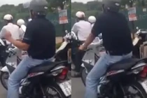 Thản nhiên gào hát khi dừng đèn đỏ ở Hà Nội