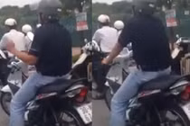 Thản nhiên gào hát khi dừng đèn đỏ ở Hà Nội