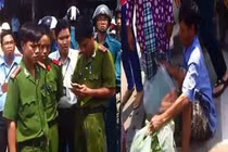 Ngồi khóc vì công an không cho bán rau