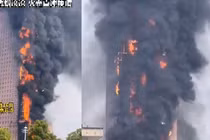 Hiện trường vụ cháy tòa nhà chọc trời chấn động ở Trung Quốc