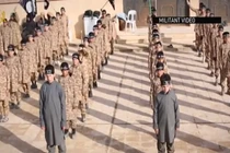 IS huấn luyện “chiến binh nhí” chặt đầu búp bê 