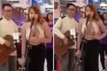 Cô nàng chuyển giới để lộ ngực trần hát trước siêu thị