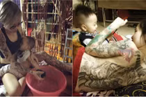 Bà mẹ Việt xăm trổ đầy mình cho con bú gây sốt