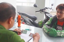 Tài xế Grab tại cơ quan công an.