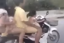 Bé gái lái xe máy chở cả gia đình lao vun vút trên phố