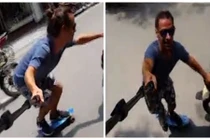 Chàng trai ngoại quốc trượt ván giữa đường phố đông đúc Hà Nội