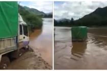 Hãi hùng cảnh tài xế liều lĩnh lái xe tải vượt sông Mã