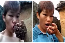Hãi hùng cảnh dị nhân cho bàn tay bám đầy ong vào miệng
