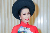 Á hậu Trịnh Kim Chi khoe nhan sắc mặn mà với áo dài đỏ rực