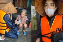 Thủy Tiên đội nón, lội nước tới gần bụng đi cứu trợ từng nhà