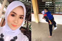 Cô giáo xinh đẹp cõng học sinh băng qua nước lũ