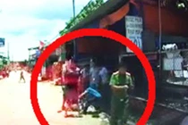 Thanh niên bị đánh túi bụi trước người mặc đồ công an