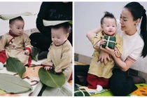 Phương Oanh khoe hai con diện áo dài ngồi xem gói bánh chưng