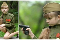 Cô bé Nga mặc quân phục... “ngắm bắn” đáng yêu