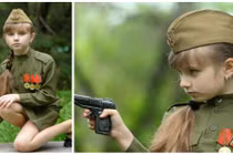 Cô bé Nga mặc quân phục... “ngắm bắn” đáng yêu