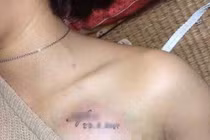 Nữ sinh xăm tên mình lên ngực có đáng bị buộc thôi học?