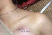 Nữ sinh xăm tên mình lên ngực có đáng bị buộc thôi học?