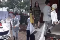 Video: Cô dâu được chú rể bế chạy vào nhà