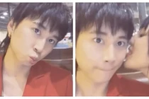 Karik phản ứng lạ khi bạn gái liếm má giữa nơi công cộng 