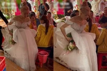 Đám cưới mùa mưa, cô dâu khổ sở "bồng váy" về nhà chồng