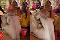 Đám cưới mùa mưa, cô dâu khổ sở "bồng váy" về nhà chồng