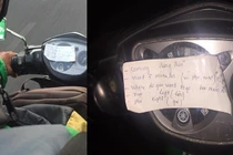 Mảnh giấy dán đầu xe Grab, người đi đường tò mò về nội dung ghi trong đó