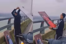 Người đàn ông vứt ảnh cưới xuống sông gây xôn xao