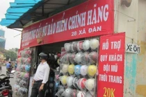 Đổi mũ bảo hiểm: Đẩy giá cao rồi... trợ giá