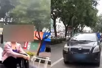 Hoảng hốt cảnh người phụ nữ ngồi bất động trên mũi xe