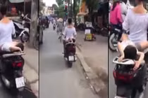 Video: Hoảng hồn cảnh mẹ chở con nằm dài sau xe máy