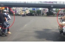 Video: Xe máy kẹp ba không mũ bảo hiểm "lặng lẽ" lùi sau xe CSGT