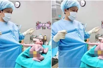 Bé con vừa chào đời đã giật áo bác sĩ đầy hờn dỗi