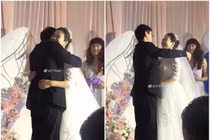 Cô dâu, chú rể rạng ngời nhưng mọi sự chú ý dồn vào người này