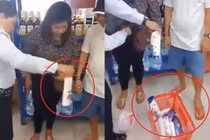 Video: Người phụ nữ giấu hơn chục món hàng trong người