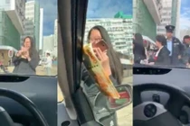 Cô gái nhận ngay kết đắng khi đứng phát tiền giữa đường