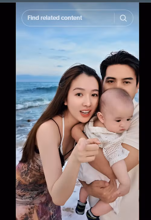 Trong vòng tay bố, bé Hin biểu cảm phụng phịu, được nhiều cư dân mạng khen dễ thương. Ảnh: TikTok Hồ Quang Hiếu.