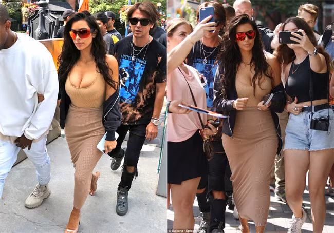 Mới đây, Kim Kardashian cùng chồng tới Toronto, Canada. Ngôi sao truyền hình thực tế gây chú ý với kiểu thời trang bức tử vòng 1 khủng.