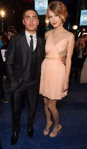 Thấp hơn Taylor Swift 5cm, Zac Efron trông thấp hơn hẳn nữ ca sĩ bởi Taylor đi đôi giầy rất cao. (Ảnh: Internet)
