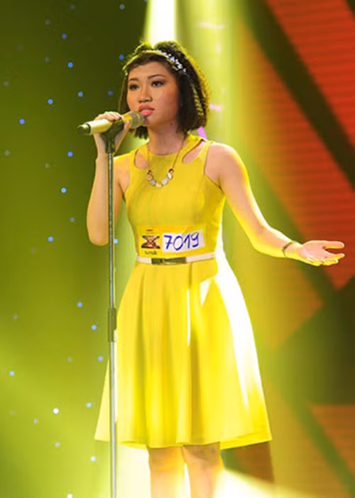 Orange tên thật là Khương Hoàn Mỹ. Năm 2014, cô tham gia chương trình Nhân tố bí ẩn. Sau khi về đội Hồ Ngọc Hà, Orange sớm dừng chân ở top 12.