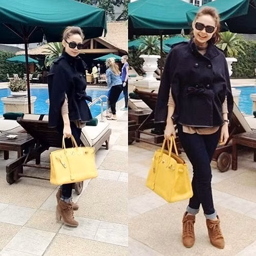 Minh Hằng sành điệu dạo phố với chiếc túi xách hàng hiệu Hermes Birkin màu vàng có giá hơn 200 triệu đồng.