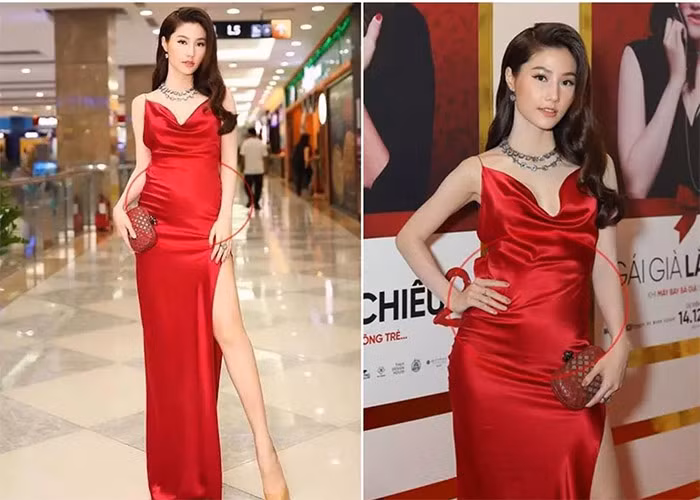 Diễm My 9x từng bị "váy áo phản chủ" khi diện chiếc váy lụa đỏ ôm sát làm vòng hai của cô nhô lên như đang có em bé. (Ảnh: 2sao)