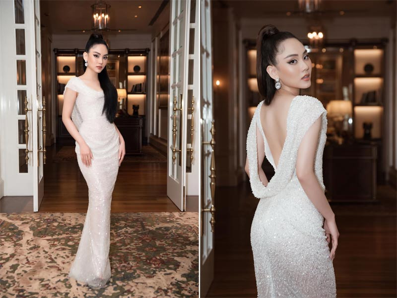 Người đẹp 23 tuổi chọn một chiếc váy kín phần trước nhưng hở rộng phần lưng rất cuốn hút.