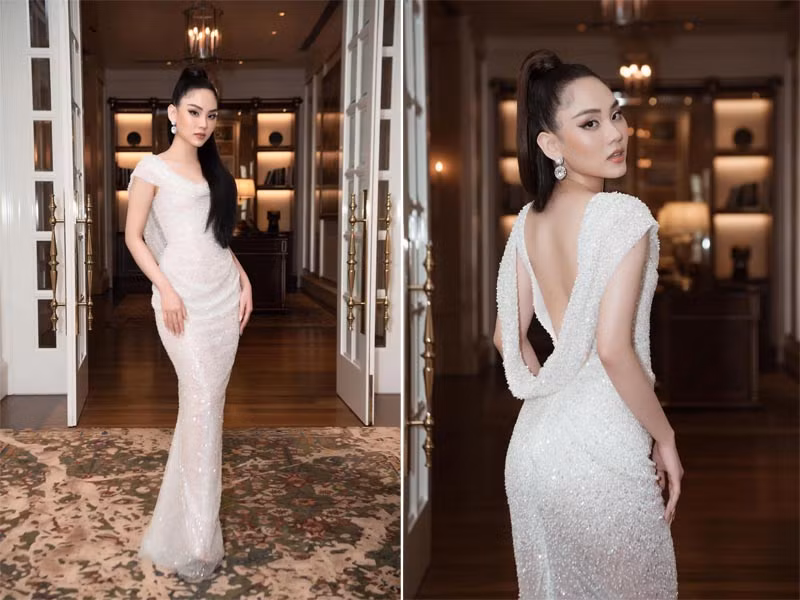 Người đẹp 23 tuổi chọn một chiếc váy kín phần trước nhưng hở rộng phần lưng rất cuốn hút.