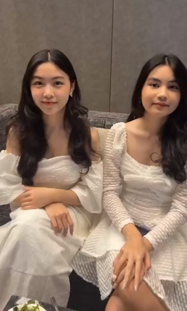 Lọ Lem - Hạt Dẻ diện váy trắng xinh như công chúa. Ảnh cắt clip Facebook MC Quyền Linh.