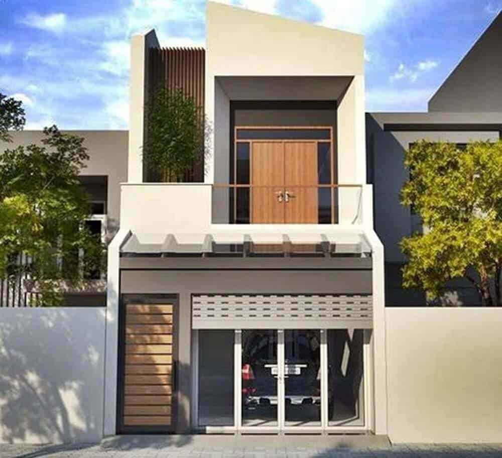 Có gara ô tô phía trong nên cửa chính bị thu hẹp còn 1m. Tầng 1 có phòng khách và phòng bếp, tầng 2 có 2 phòng ngủ. Ảnh: Noithatduongdai.