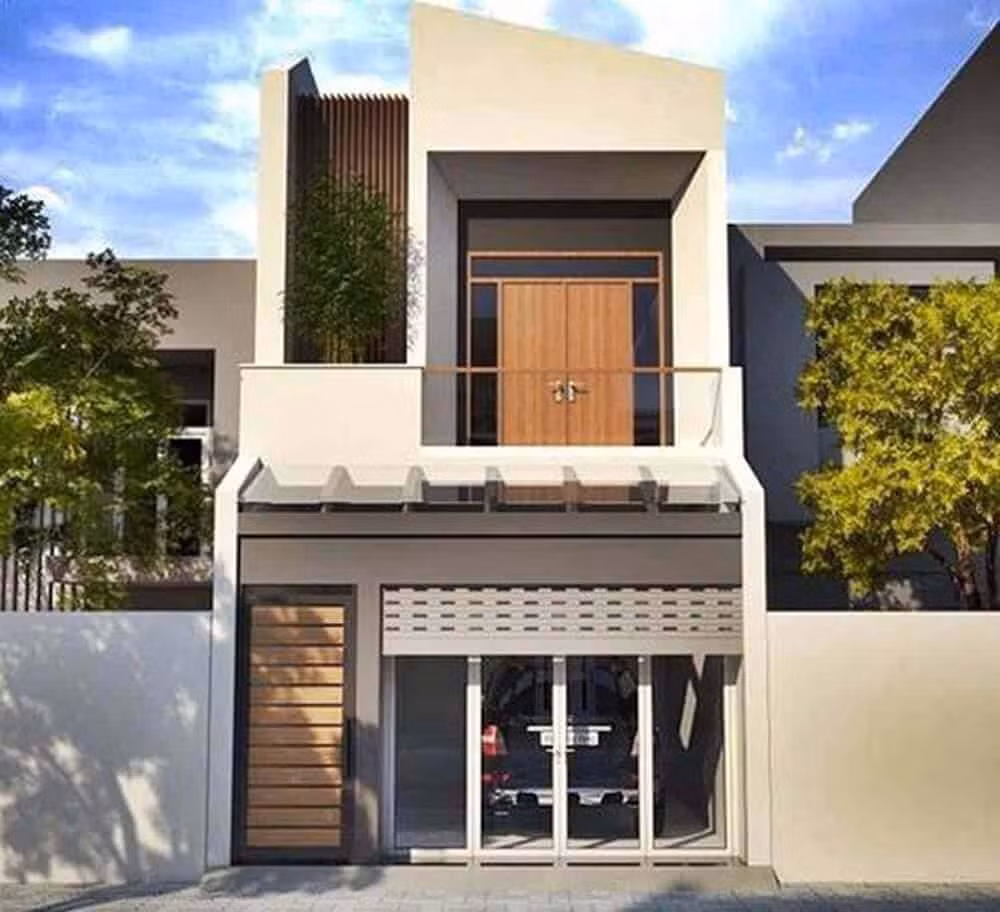 Có gara ô tô phía trong nên cửa chính bị thu hẹp còn 1m. Tầng 1 có phòng khách và phòng bếp, tầng 2 có 2 phòng ngủ. Ảnh: Noithatduongdai.