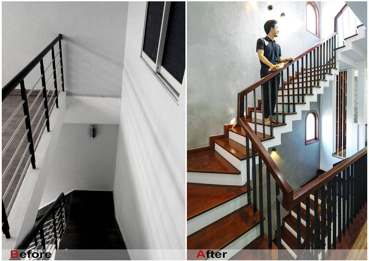 Cầu thang lát gỗ sáng màu cùng với hệ thống đèn vàng mang vẻ đẹp cổ điển.