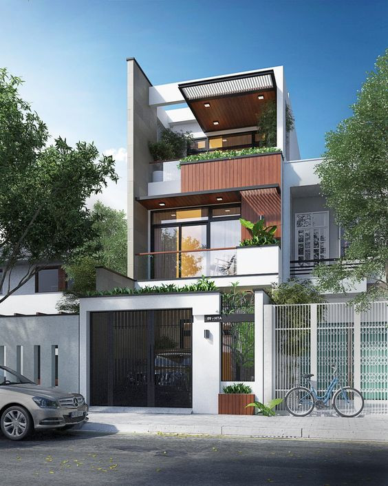 Nhà 3 tầng mang hơi thở hiện đại nhưng vô cùng gần gũi với thiết kế cây xanh và vật liệu gỗ quen thuộc. Ảnh: Xaynhapho.