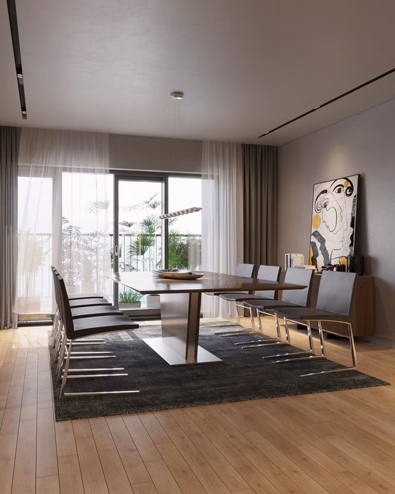 Bàn ăn lớn có cửa kính hướng ra ban công.